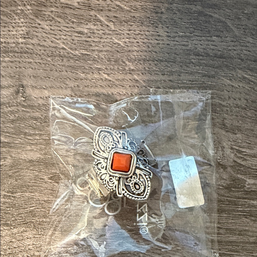 Ornate Silver-Tone Ring with Orange Stone